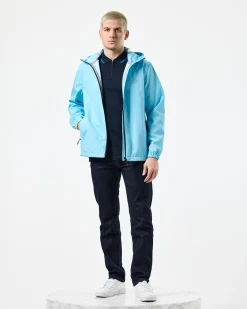 Football + Festivals Wasserdichte Pack-Away-Jacke Ocean Wave Blue